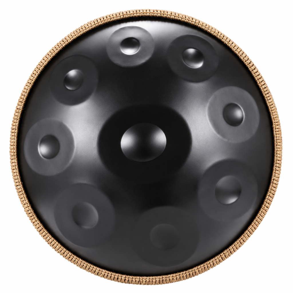 Top view of a black 22-inch steel handpan with raised tone fields and a gold-tone braided rim