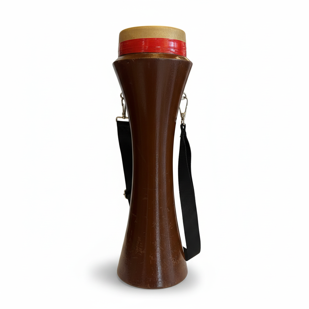 Kasoor traditional hand drum shown upright from the front with brown shaped body, red-accented top rim, and black shoulder strap on a white background