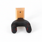 J-19A guitar hanger shown from the front with its black padded arms, red accents, and mounting structure