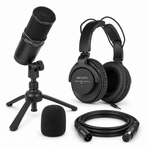 Angled view of the Zoom ZDM-1 microphone pack with tabletop tripod and headphones