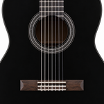 Close-up of the Yamaha C40's soundhole, rosette, strings and black finish.