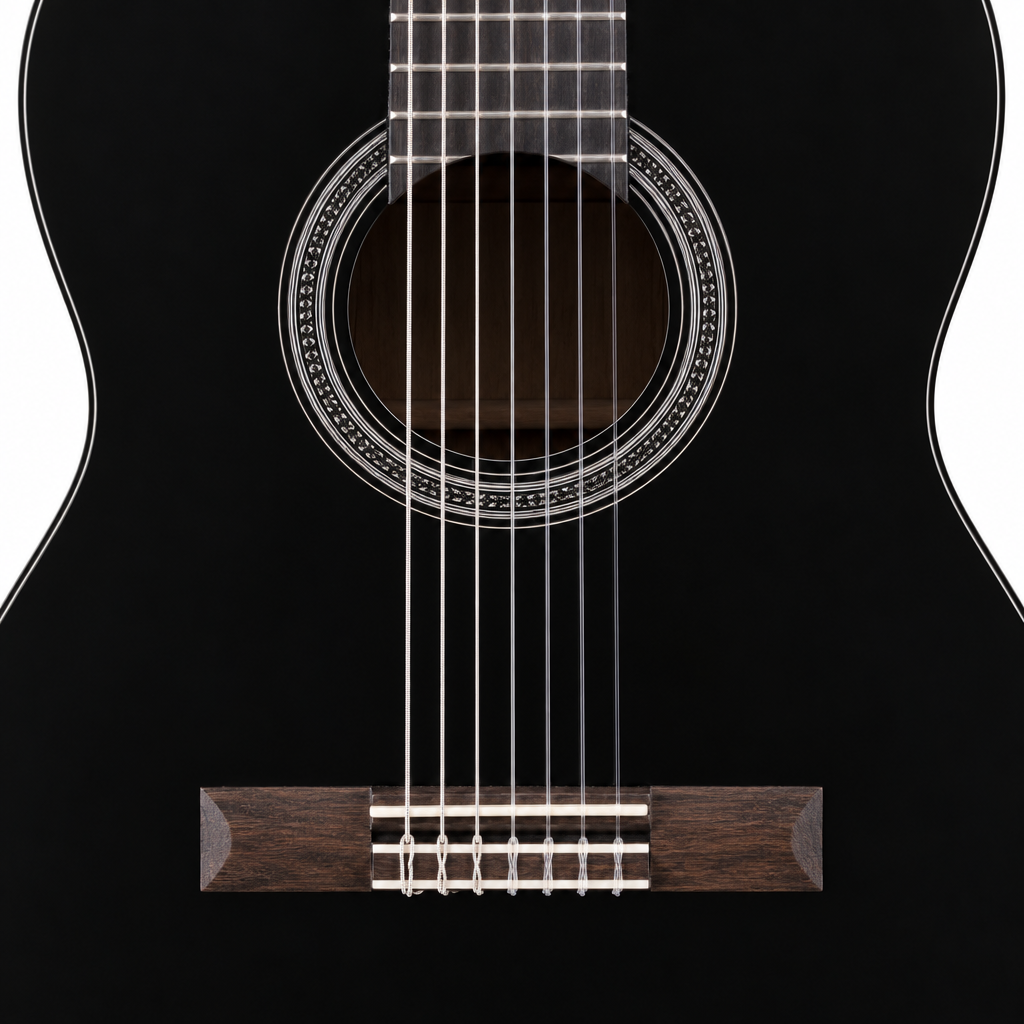 Close-up of the Yamaha C40's soundhole, rosette, strings and black finish.