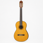 Straight-on full front view of the Yamaha C80 classical guitar showing its spruce top, strings, rosette, and bridge.