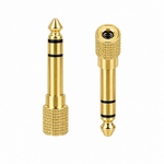 Unbranded gold jack converter shown from the front with its two converter pieces and gold connector bodies