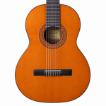 Close-up of the orange Rockdale Classic C4 spruce top, rosette, sound hole, strings, and bridge