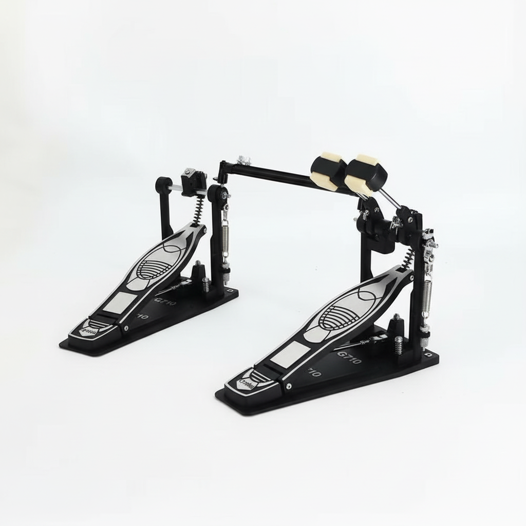 One Cymbal G710 double bass drum pedal unit shown in a three-quarter diagonal view with both pedal boards, linkage, beaters, springs, and hardware
