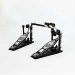 One Cymbal G710 double bass drum pedal unit shown in a three-quarter diagonal view with both pedal boards, linkage, beaters, springs, and hardware