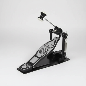 One Cymbal G610 black single drum pedal shown in a three-quarter diagonal view with its pedal board, beater, spring, frame, and hardware
