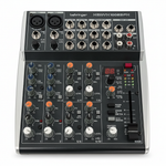 Behringer XENYX 1002SFX 10-input analog mixer shown from the front with its input sockets, knobs, faders, USB area, and Behringer branding