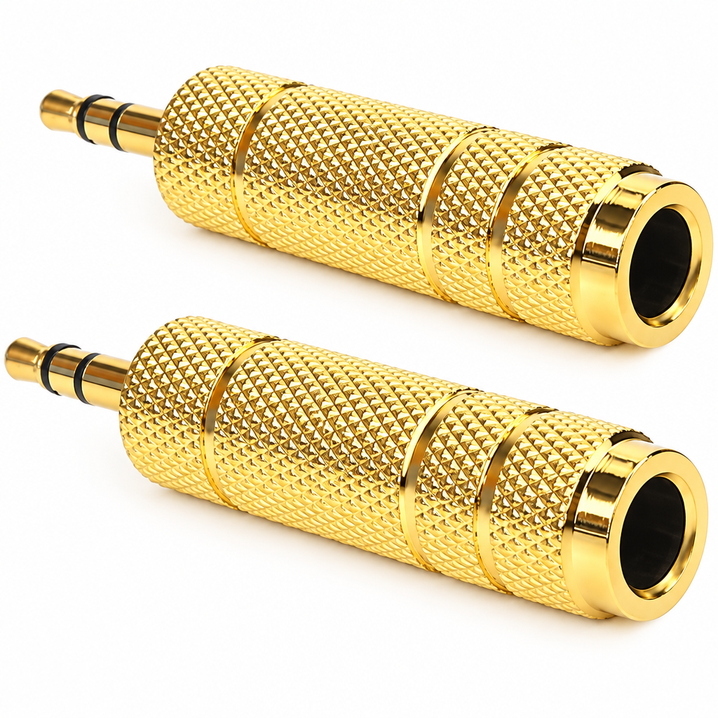 Close detail of two identical gold cylindrical jack converter pieces with knurled barrels, black insulating rings, male plug tips, and female socket openings