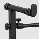 Close detail of the unbranded Q-50 keyboard stand extension mounting bracket, adjustment knobs, clamp hardware, and padded support arm