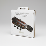 Ibanez ICLS6HT classical guitar strings package shown at a 45 degree angle with the front label, Hard Tension, listed gauges, and package edge visible on a clean white background