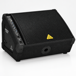Three-quarter view of the Behringer Eurolive F1320D active floor monitor showing its wedge cabinet and control panel.