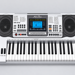Close detail of the unbranded MK810 electronic keyboard LCD screen, control panel, speakers, pitch-bend controls, and upper keys