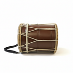 Large Rahmani hand drum placed horizontally on its side, showing the long brown body, light rims, rope tensioning, and shoulder strap on a white background