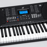 Close detail of the unbranded MK821 portable keyboard control panel, LCD display, buttons, speakers, and keys