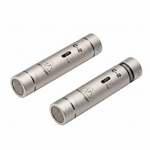 Two Behringer C-2 silver matched condenser microphones shown from a high angled view with circular grilles, cylindrical bodies, C-2 markings, and Behringer branding