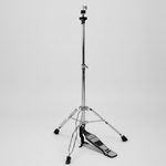One Cymbal G500 cymbal stand shown in a three-quarter diagonal view with its tripod base, stand hardware, and integrated pedal at the lower end