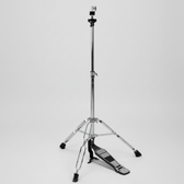 One Cymbal G500 cymbal stand shown in a three-quarter diagonal view with its tripod base, stand hardware, and integrated pedal at the lower end