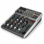 Behringer XENYX 1002SFX 10-input analog mixer shown from a high angle with channel controls, knobs, faders, input section, and Behringer branding