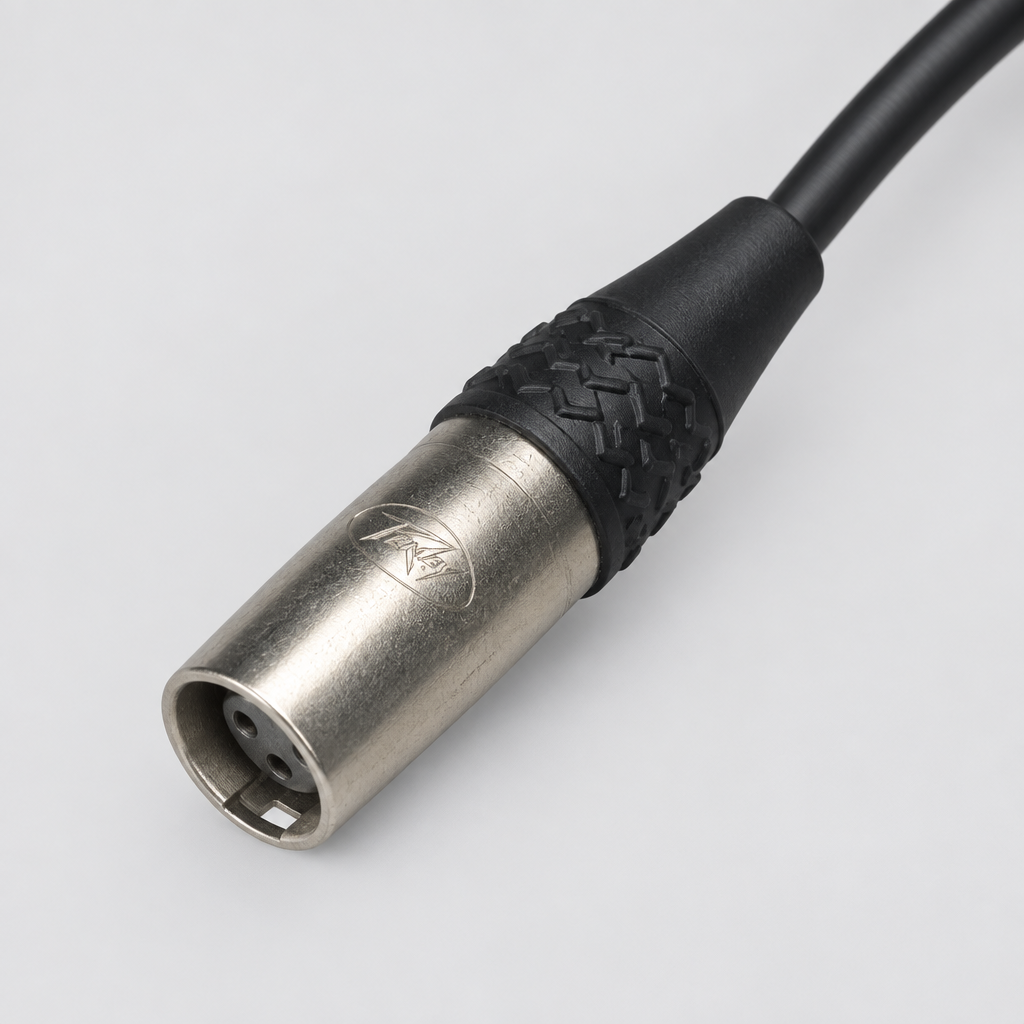 Close-up of one Peavey PV100 microphone cable connector and its attached cable jacket.