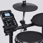 Close detail of the Medeli DD630S sound module with LCD display, buttons, mesh snare, cymbal pad, and tom pad