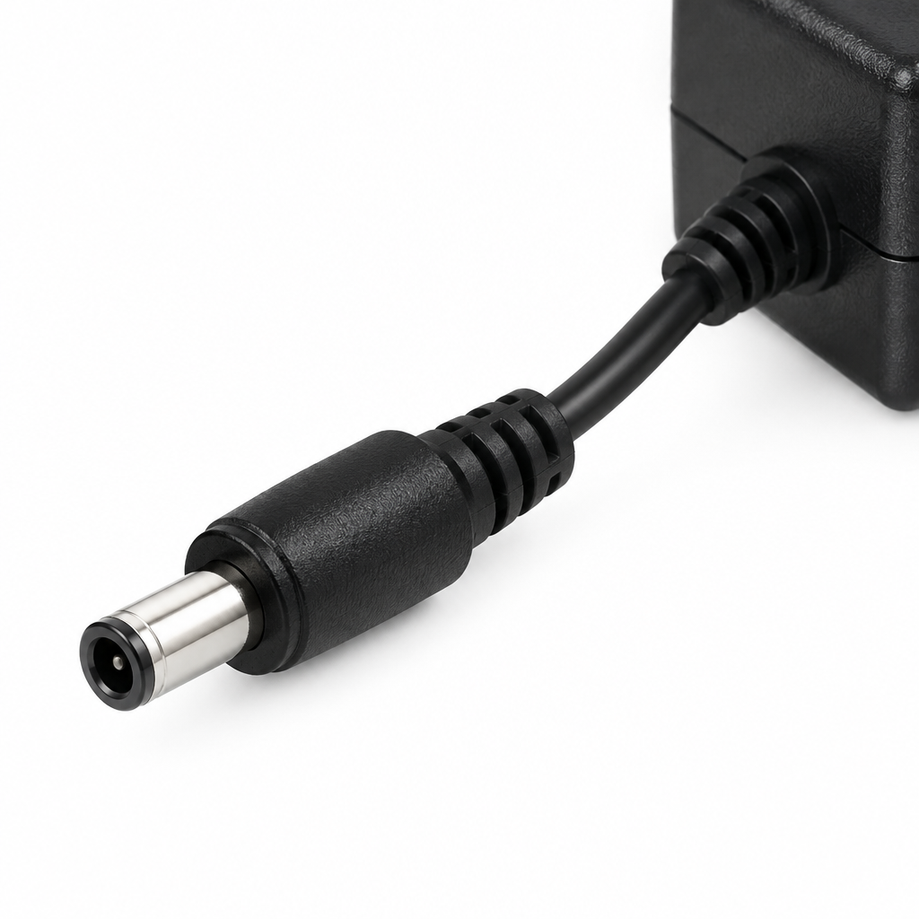 Close-up of the Yamaha PA 150B adapter's DC barrel connector and cable strain relief