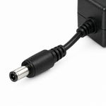 Close-up of the Yamaha PA 150B adapter's DC barrel connector and cable strain relief