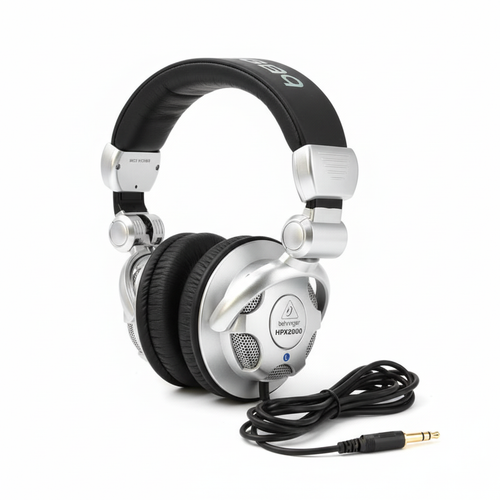 Behringer HPX2000 closed-back DJ headphones shown in a complete three-quarter view with swiveling ear cups and cable on a white background
