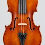 Close-up of the 4/4 violin bridge, strings, fingerboard, and f-holes.