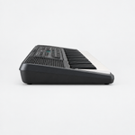 Side profile of the Yamaha PSR-E273 portable keyboard showing its shallow body and keys.