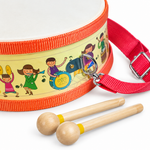 Close-up of wooden toy drum strap attachment and two wooden mallets