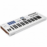 Arturia KeyLab Essential 61 Alpine White MIDI keyboard shown from a three-quarter angle, highlighting the keys, 16 pads, display, knobs, and faders on a white background
