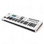Arturia KeyLab Essential 61 Alpine White MIDI keyboard shown at an angled view with its 61 keys, pads, display, knobs, and faders visible on a white background