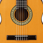 Close-up of the Ibanez GA3-AM's soundhole, mosaic rosette, nylon strings and spruce top.