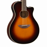 Close-up of the Yamaha APX600 OVS soundhole, bridge, strings, and side controls