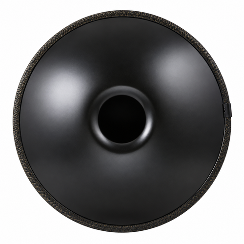 Underside of a black steel handpan showing the center sound opening and braided edge