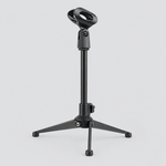 Unbranded ZM-07 mini microphone stand shown from a three-quarter angle with its microphone clip, adjustment joint, and round base