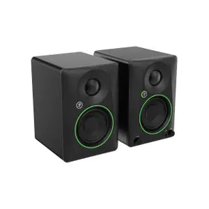 Pair of black studio monitors with green accents on a white background