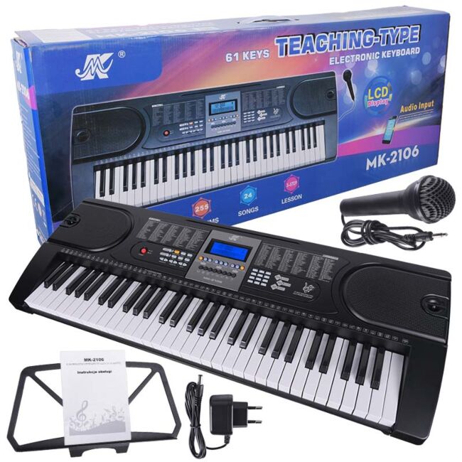 Electronic keyboard with accessories and packaging on a white background