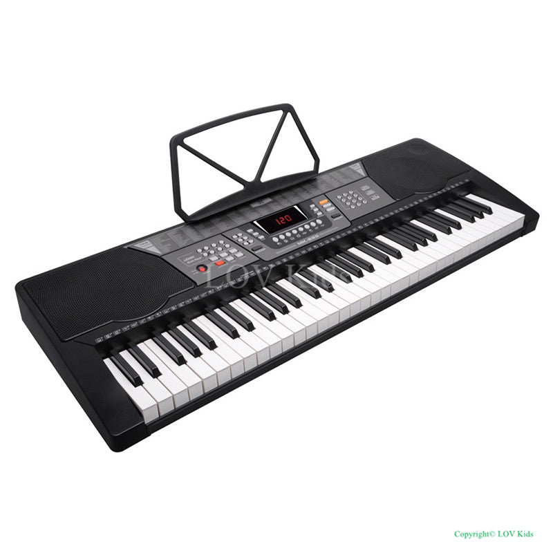 Electronic keyboard with music stand on a white background