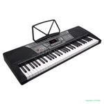 Electronic keyboard with music stand on a white background