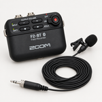 Zoom F2-BT/B field recorder and LMF-2 lavalier microphone arranged together.