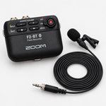 Zoom F2-BT/B field recorder with the included LMF-2 lavalier microphone and cable.