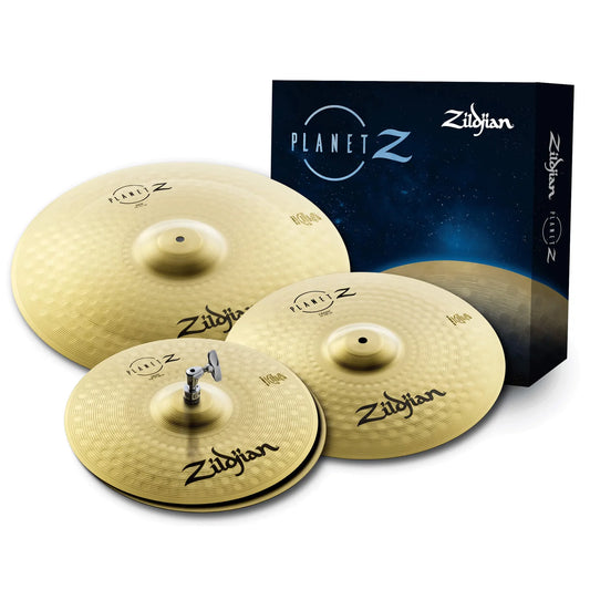 A set of Zildjian cymbals including 14 inch hi-hats and an 18 inch crash ride, displayed in front of their packaging.